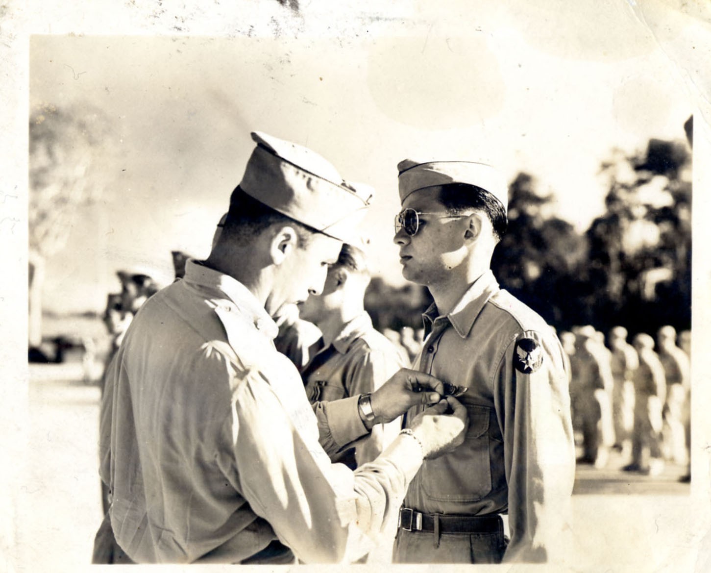 A render of three white cylindrical columns, against a warm creme background