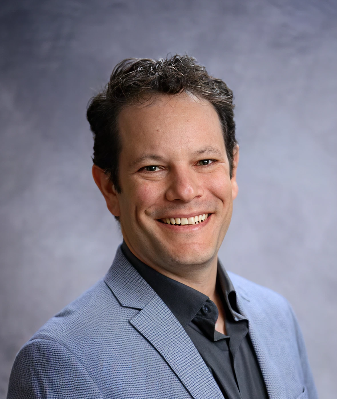 A render of three white cylindrical columns, against a warm creme background
